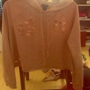 Light pink cropped and ripped hoodie